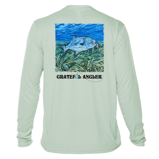 back of seagrass Grateful Angler Artist's Collection: Catch Your Dreams UV Shirt showing vibrant artwork of fish above the reeds