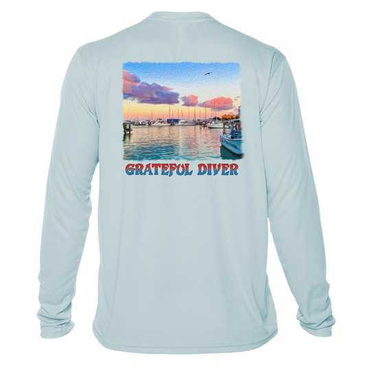 back of the Grateful Diver's Artist's Collection: Captain's Corner UV Shirt in arctic blue showing docked boats at sunrise