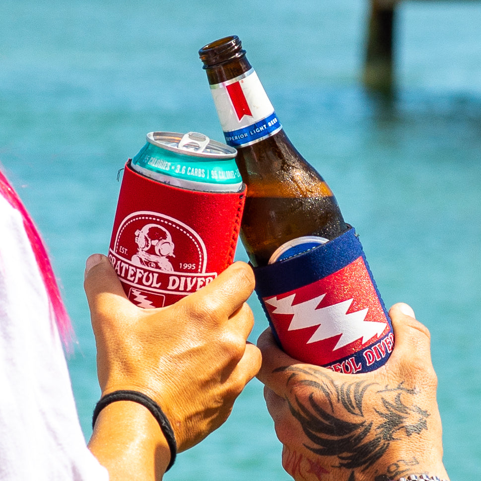 Grateful Diver Dive Helmet & Classic Can Koozies doing a cheers