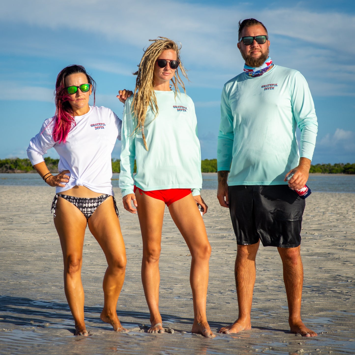 Grateful Diver Classic UV Shirt in white and seagrass on three models front shots on sandbar