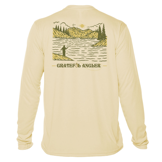 back of pale yellow Grateful Angler Mountain Fishing UV Shirt showing a person fishing along the banks of a mountain lake