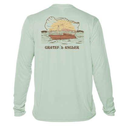 back of seagrass Grateful Angler Tossing the Cast Net UV Shirt showing a person throwing the cast net over the side of a boat